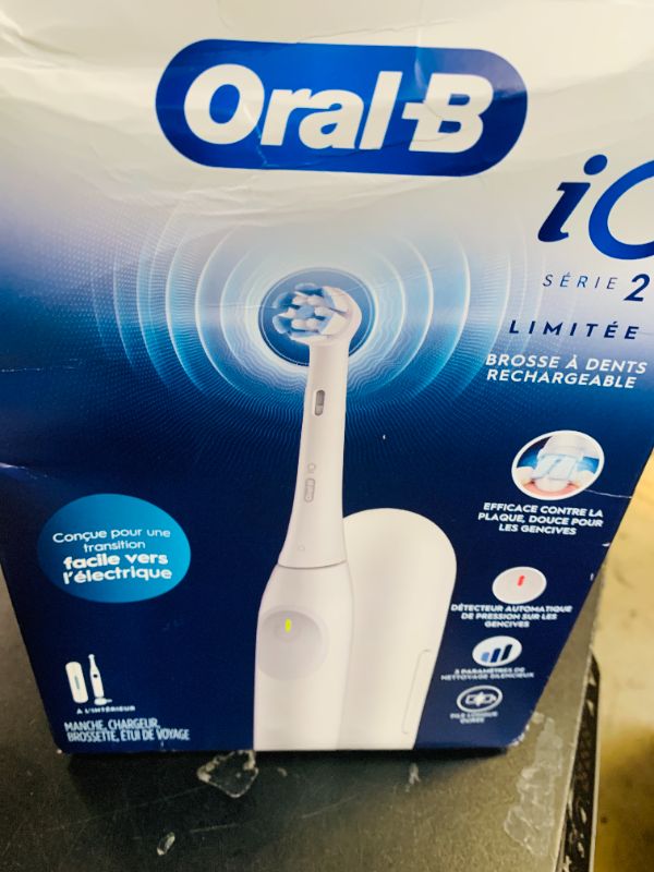 Photo 1 of Oral-B iO Simple Clean Rechargeable Electric Powered Toothbrush, Pure White with 1 Gentle Care Brush Head and 1 White Travel Case - Automatic Pressure Sensor to Protect Gums - 3 Modes -2 Min Timer
