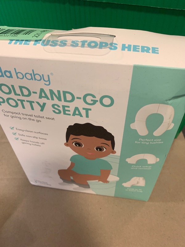 Photo 1 of Frida Baby Fold-and-Go Portable Potty Seat for Toilet, Foldable Travel Potty Seat for Toddler, Fits Round & Oval Toilets, Non-Slip Base, Handles, Includes Free Travel Bag