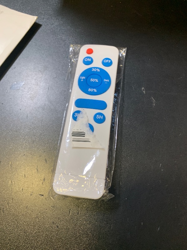 Photo 1 of White tv remote control 