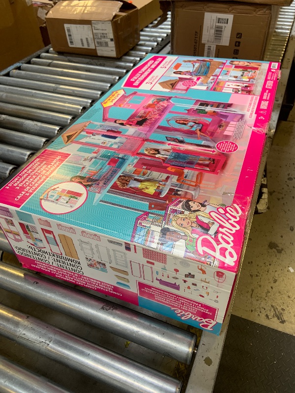 Photo 1 of Barbie 3-Story Townhouse Dollhouse with Elevator, Swing Chair, Furniture and Accessories, Fold for Portability and Travel (Amazon Exclusive)