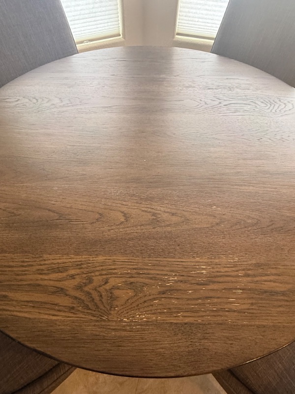 Photo 1 of 47” ROUND WOOD TABLE W 4 GREY UPHOLSTERED SIDE CHAIRS H30”