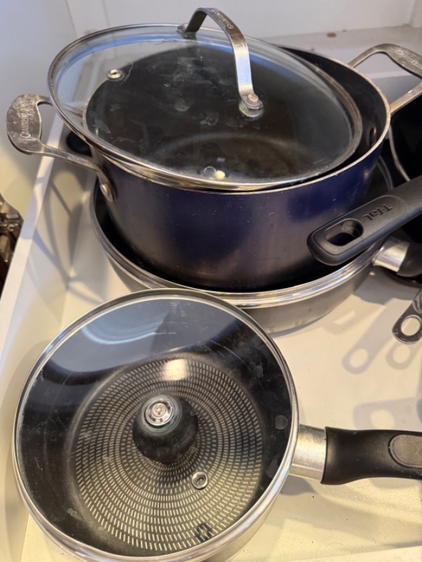 Photo 1 of CONTENTS OF KITCHEN CABINET-POTS & PANS