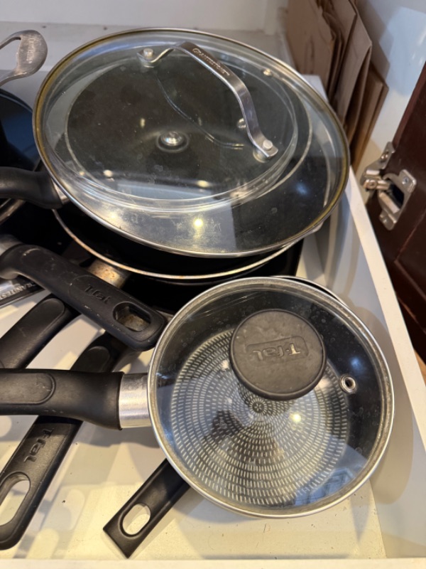 Photo 1 of CONTENTS OF KITCHEN CABINET-POTS & PANS