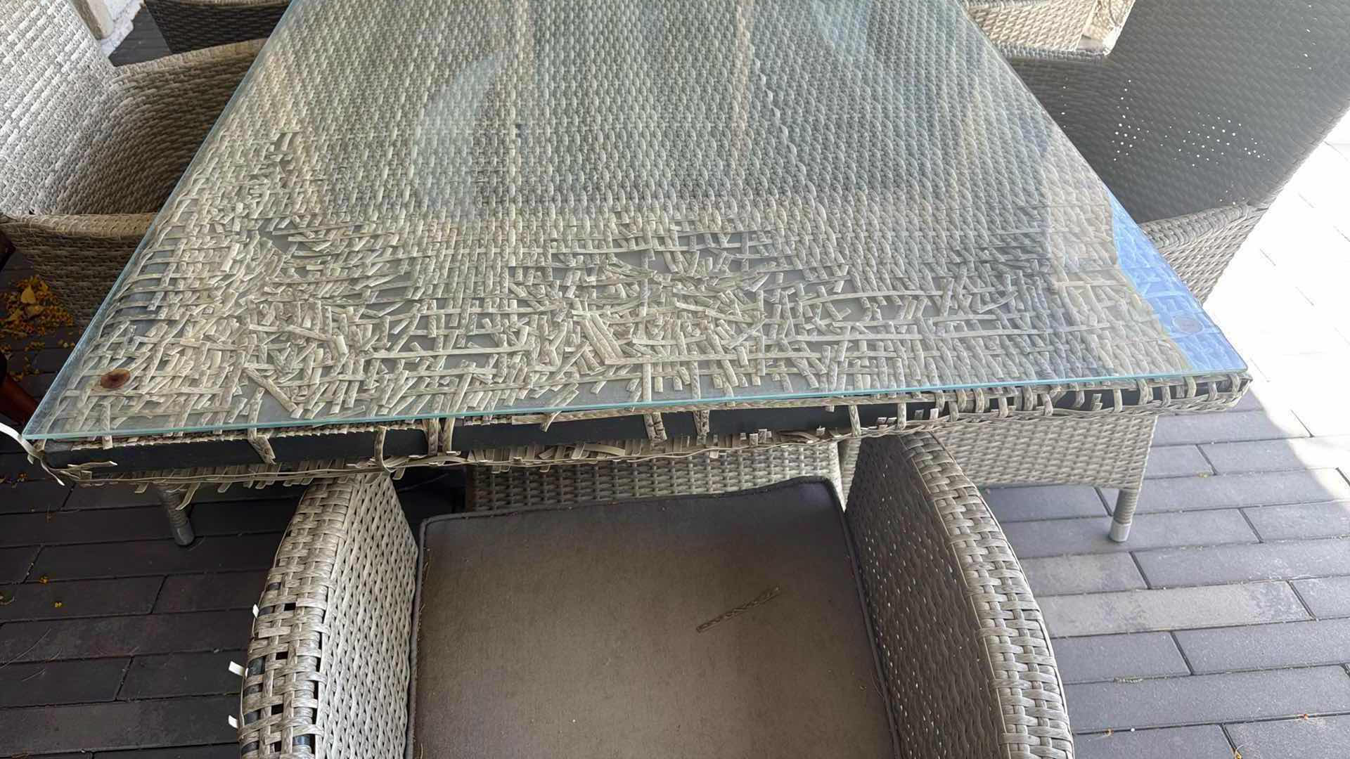Photo 1 of WICKER PATIO LIGHT GRAY TABLE W GLASS TOP PROTECTOR & 6 ARM CHAIRS 79” x 40” H29” (SEE NOTES)