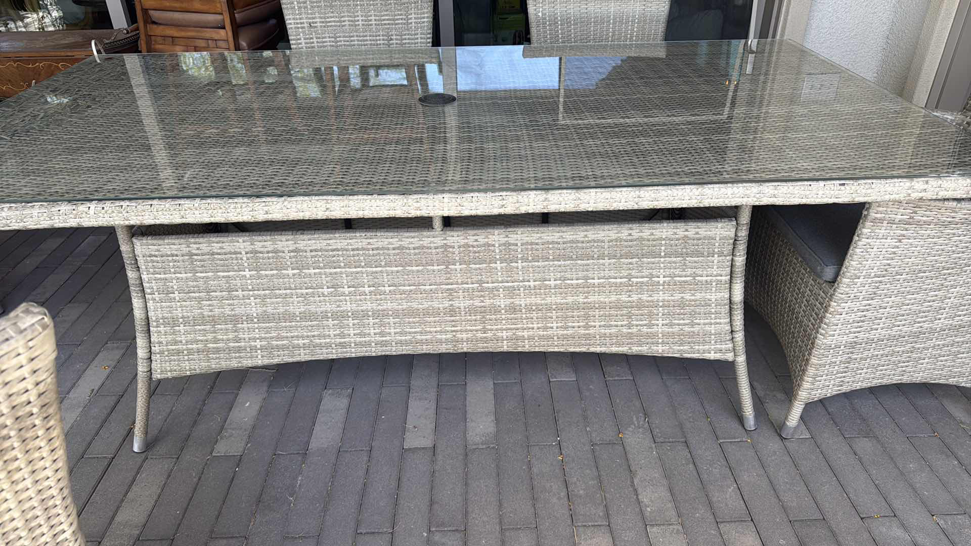 Photo 1 of WICKER PATIO LIGHT GRAY TABLE W GLASS TOP PROTECTOR & 6 ARM CHAIRS 79” x 40” H29” (SEE NOTES)