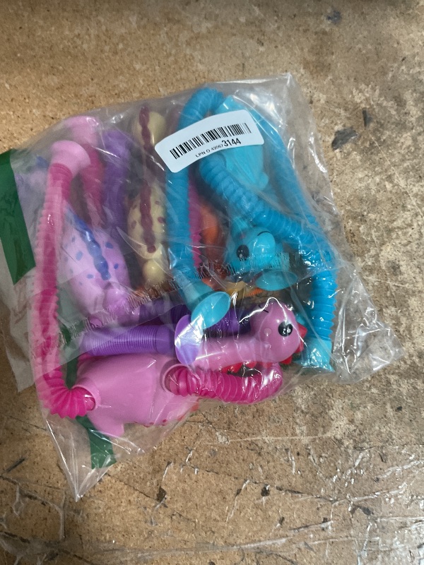 Photo 1 of 4Pcs Dinosaur Stocking Stuffers Airplane Travel Toys for Toddlers Kid Boys Girls Year Old Age 3+ Sensory Suction Tube ADHD Autism Road Trip Car Activities Essential Pop Fidget Toys Autistic Kid Gift