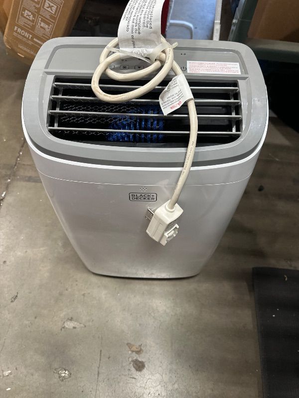 Photo 1 of ** used item, dirty, leaks **
BLACK+DECKER Portable Air Conditioner, 9,000 BTU (5,300 BTU SACC) for Rooms up to 400 Sq. Ft., Portable AC with Follow Me Remote Control and Window Kit, BPACT08WT, White