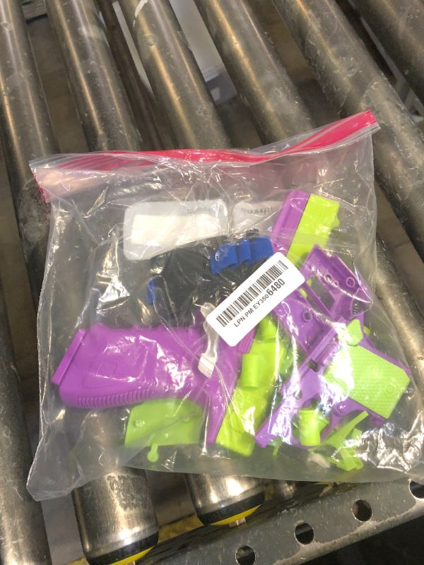 Photo 1 of LLESSOO Shell Ejecting Toy, 2 Packs Fidget Toys, Toys with 10 Shells Can be Loaded but Can't be Fired, Great Birthday Gifts for Boys Kids Adults (Purple)