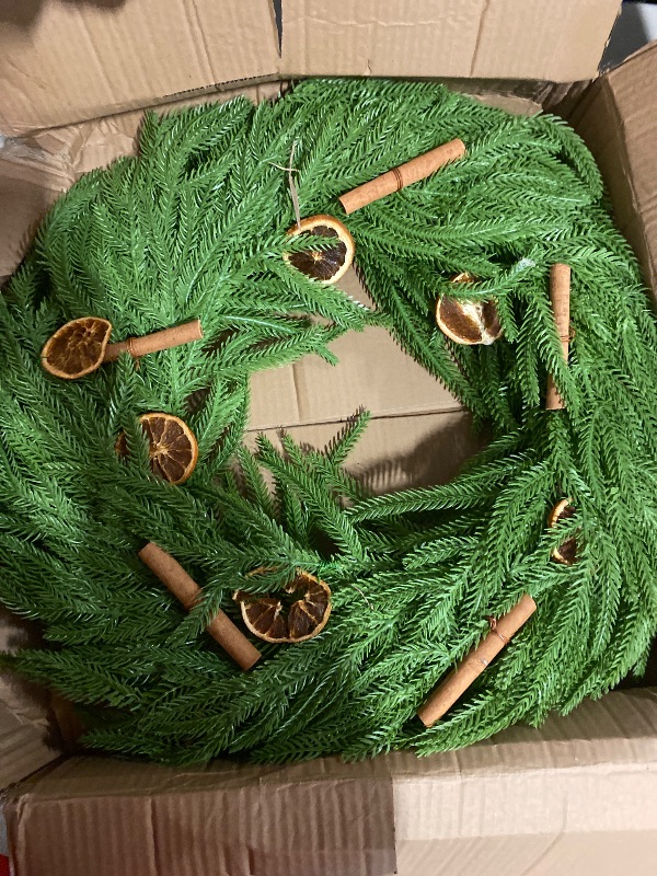 Photo 1 of Real Touch Norfolk Pine Wreath, Christmas Wreaths for Front Door with Natural Dried Orange Slices and Cinnamon Artificial Green Wreath Holiday Decoration for Indoor Outdoor Home Decor