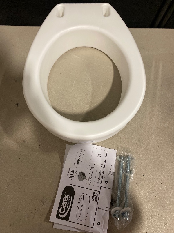 Photo 1 of Carex Toilet Seat Riser, Round Raised Toilet Seat Adds 3.5 inches to Toilet Height, for Assistance Bending or Sitting, 300 Pound Weight Capacity Toilet Riser