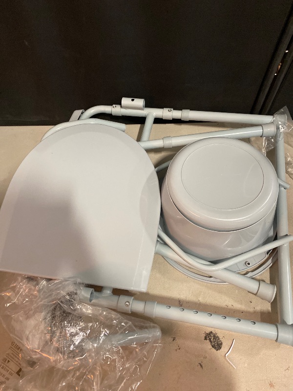 Photo 1 of Drive Medical 11148-1 Folding Steel Bedside Commode Chair, Portable Toilet, Supports Individuals Weighing Up To 350 Lbs, with 7.5 Qt. Bucket and 13.5 Inch Seat, Grey