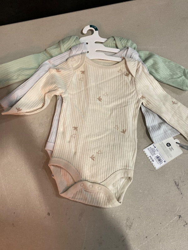 Photo 1 of Size 0-3M Baby 3pk Solid Long Sleeve Wide Ribbed Bodysuit - Cloud Island™ 0-3M: Cotton, Midweight, Snap Closure