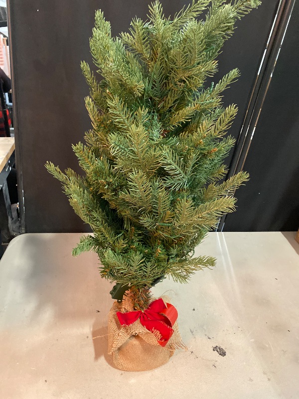 Photo 1 of National Tree Company 3 ft Pre-Lit Nordic Spruce Mini Artificial Christmas Tree, Burlap Base, Red Bow, 50 Clear LED Lights, 363 Tips, Timer, Green