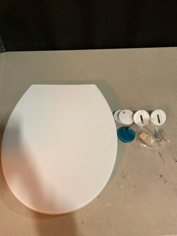 Photo 1 of Gerber Soft-Close Elongated Toilet Seat with Two Button Quick-Release, Top-Mount Installation, Non-Slip Bumpers, and Cover, Heavy-Duty Plastic, White, GC550130