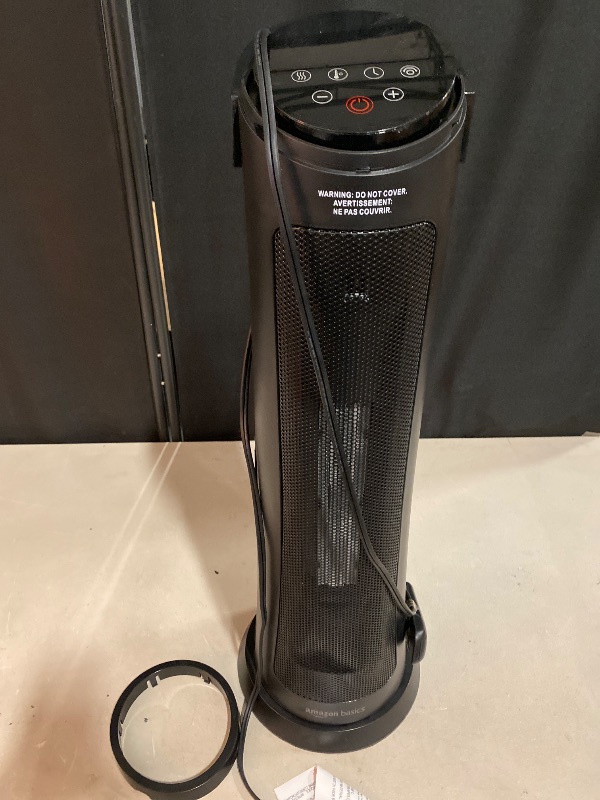 Photo 1 of Amazon Basics 28-Inch Oscillating Tower Heater, With Over-Heat and Tip-Over Protection, 2 Heat Settings and Fan Mode, Timer, Remote Control, LED Display, 1500W, Black, 9.4"D x 9.4"W x 28.6"H