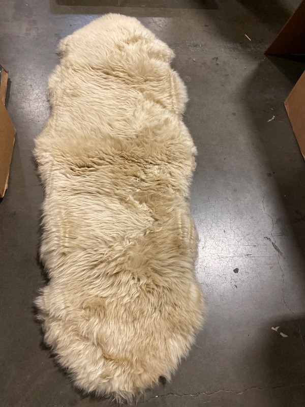 Photo 1 of LLB Genuine Sheepskin Area Rug Wool Rug Fur Carpet Fluffy Shaggy Fur Rug for Living Room Kids Bedroom Real Sheepskin Throw Lambskin Rugs Sofa Mat Chair Seat Covers (Tan, 2 x 6 ft Sheepskin)