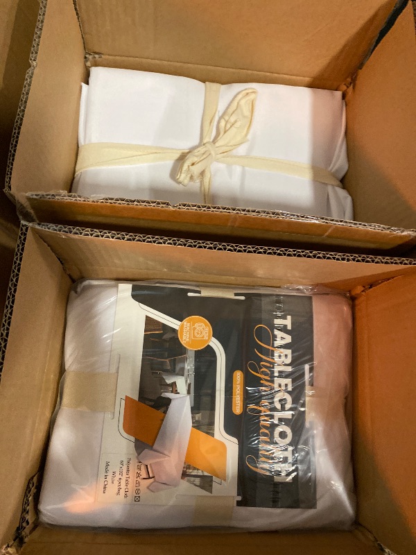 Photo 1 of BIGTONE 12 Pack White Rectangle Tablecloth 60 x 102 Inch, Cross Ribbon Packing Reusable Table Clothes for 6 Foot Tables, Wrinkle Resistant Polyester Fabric Table Cover for Wedding, Party, Banquet