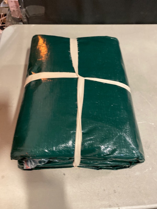 Photo 1 of Kesfitt 16 Mil Heavy Duty Waterproof Tarp with Metal Grommets, Dark Green & Blue Reversible Poly Tarp, 10x20 ft, for Outdoor Protection, Yard, Garden, Farm, Camping & Equipment Coverage