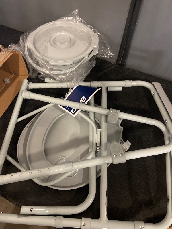 Photo 1 of Drive Medical 11148-1 Folding Steel Bedside Commode Chair, Portable Toilet, Supports Individuals Weighing Up To 350 Lbs, with 7.5 Qt. Bucket and 13.5 Inch Seat, Grey