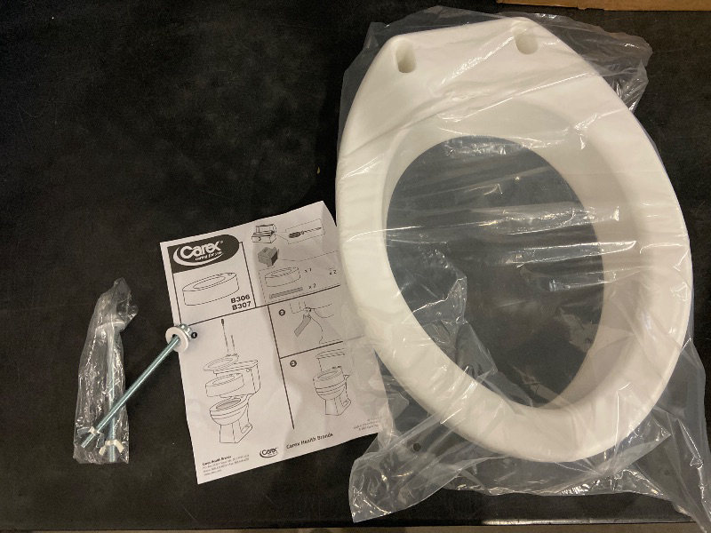 Photo 1 of Carex Toilet Seat Riser, Elongated Raised Toilet Seat Adds 3.5 inches to Toilet Height, for Assistance Bending or Sitting, 300 Pound Weight Capacity Toilet Riser