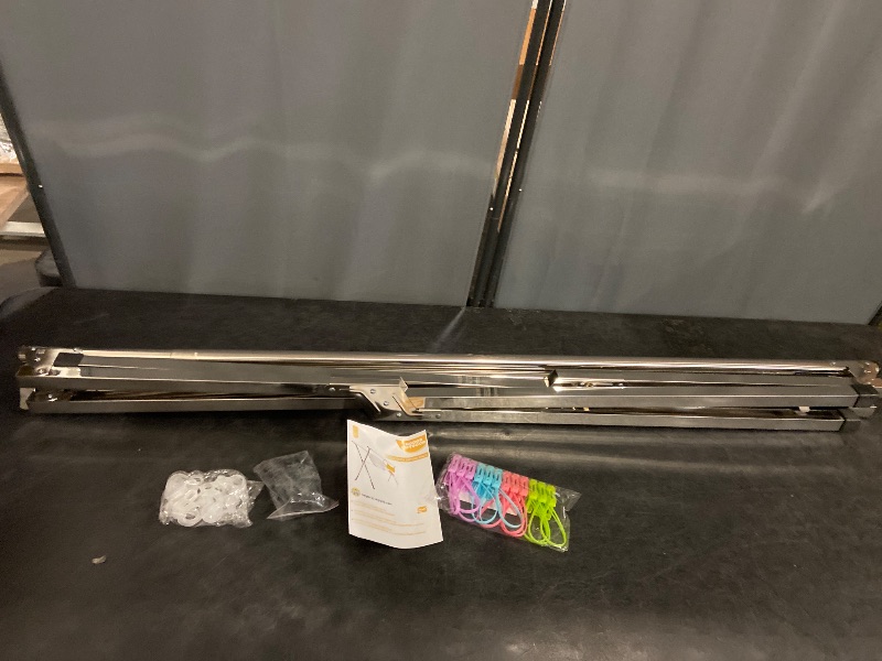 Photo 1 of Clothes Drying Rack 63 Inches Folding Indoor Outdoor, Drying Rack Clothing Collapsible, Foldable Portable Laundry Drying Rack, Heavy Duty Laundry Hanger Dryer Rack, with 20 Hooks 12 Clips
