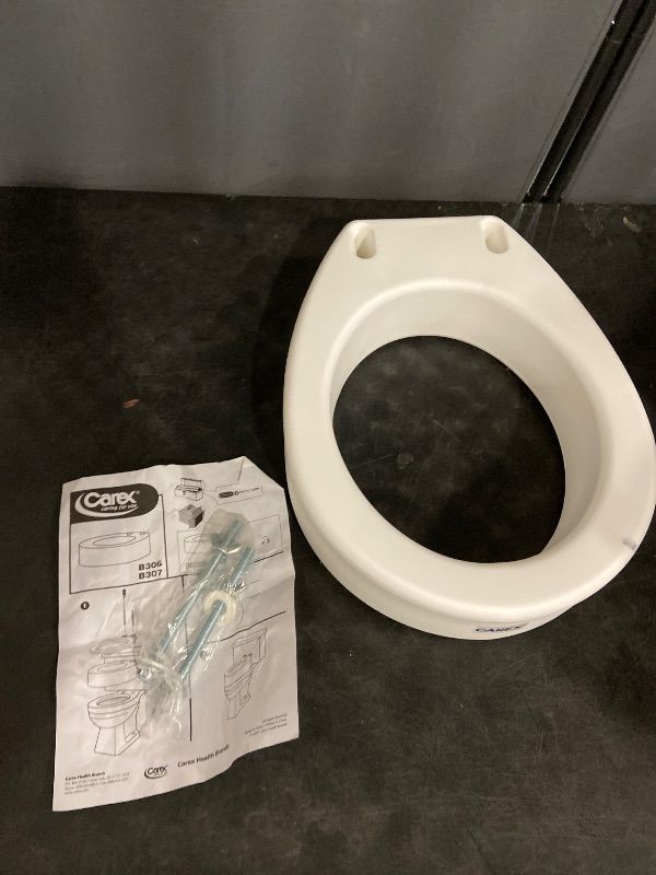 Photo 1 of Carex Toilet Seat Riser, Elongated Raised Toilet Seat Adds 3.5 inches to Toilet Height, for Assistance Bending or Sitting, 300 Pound Weight Capacity Toilet Riser