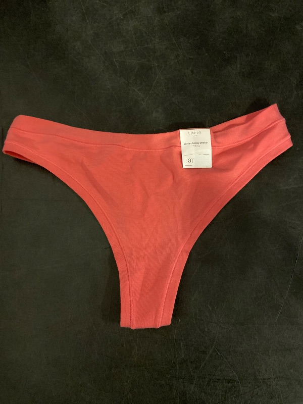 Photo 1 of Size L Women's Cotton Stretch Comfort Thong - Auden™ Coral L: Low Rise, Fold Over Waistband, Midweight Jersey, Machine Washable