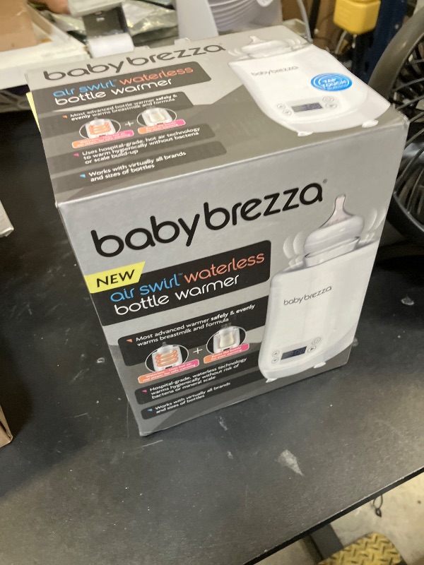Photo 1 of Baby Brezza AirSwirl Waterless Baby Bottle Warmer - Safely Warm Breastmilk + Formula - Bottles Stay Dry + Nutrients are Protected - Works with Nearly All Bottles