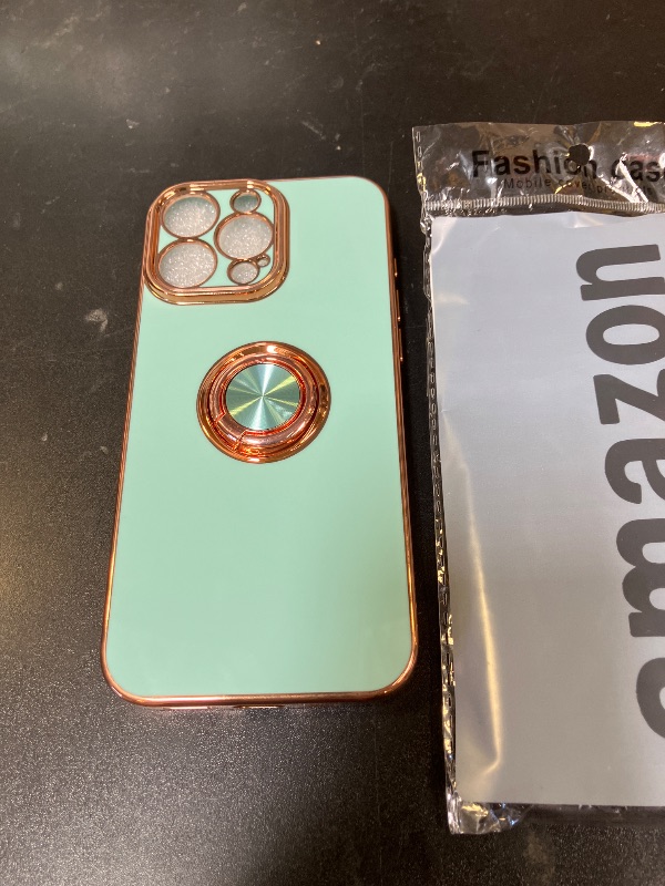 Photo 1 of  mint green iPhone 16Pro case with a ring holder kickstand