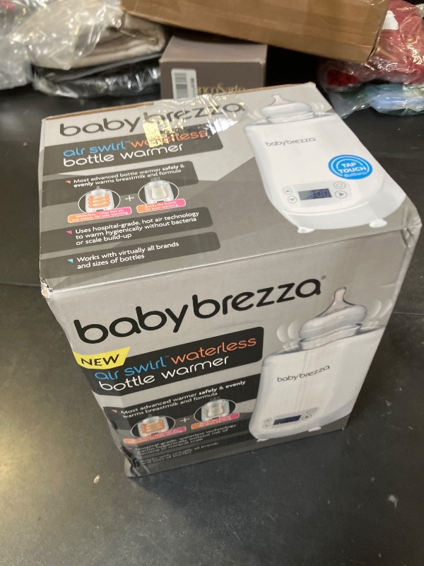Photo 1 of Baby Brezza AirSwirl Waterless Baby Bottle Warmer - Safely Warm Breastmilk + Formula - Bottles Stay Dry + Nutrients are Protected - Works with Nearly All Bottles
