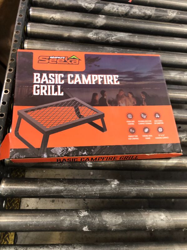 Photo 1 of Adventure Seeka Folding Campfire Grill – Portable Over-Fire Grill with Food-Safe Coating, Heavy Duty Steel, Compact with Folding Legs - Camping, RV, Overlanding, Fire Pits