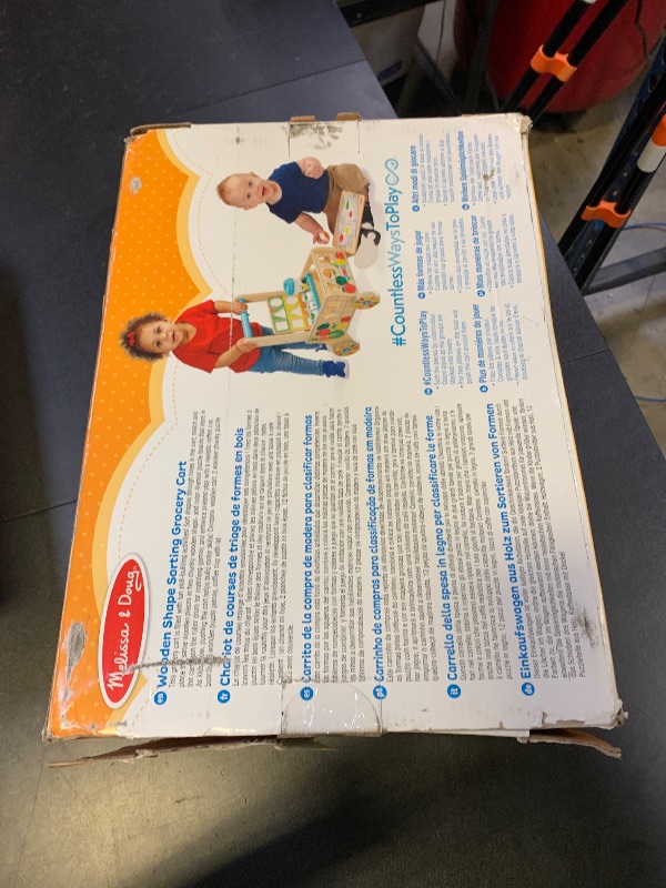Photo 1 of Melissa & Doug Wooden Shape Sorting Grocery Cart Push Toy and Puzzles - Pretend Play Grocery Toys, Sorting and Stacking Toys for Infants and Toddlers Ages 1+ - FSC-Certified Materials