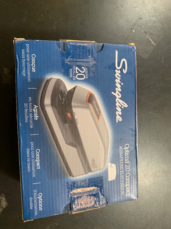 Photo 1 of Swingline Electric Stapler, 20 Sheet Capacity, Optima 20, Jam Free, Compact, Automatic or Manual, Plug In or Battery, Orange and Gray (48207)