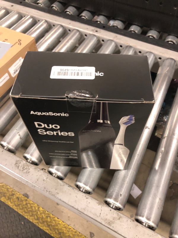 Photo 1 of Aquasonic Duo - Dual Handle Ultra Whitening 40,000 VPM Wireless Charging Electric ToothBrushes - 3 Modes with Smart Timers - 10 Dupont Brush Heads & 2 Travel Cases Included