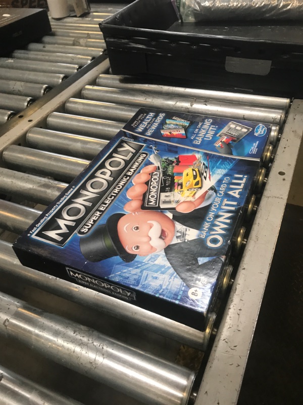 Photo 1 of Hasbro Gaming Monopoly Super Electronic Banking Board Game, Electronic Banking Unit, Choose Your Rewards, Cashless Gameplay Tap Technology, for Ages 8 and Up