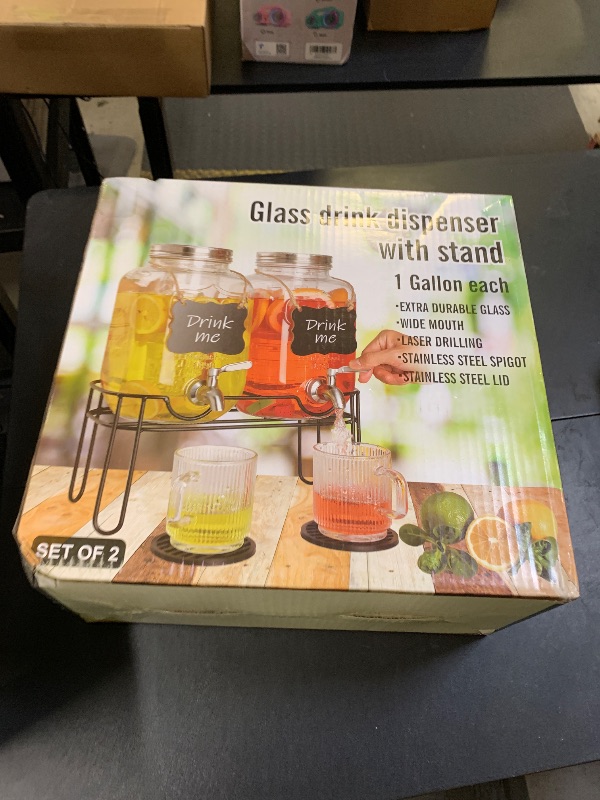 Photo 1 of Drink Dispenser,2PACK Glass Drink Dispensers for Parties,1 Gallon Beverage Dispenser with Stand, Stainless Steel Spigot Leak proof,Come with Ice Cylinder,Fruit Tube and 2 Rubber Mats