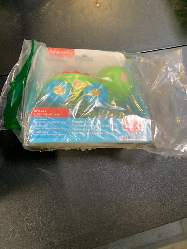 Photo 1 of Fisher-Price Baby Crawling Toy Poppity Pop Turtle Push-Along Vehicle with Ball Popping Sounds for Infants Ages 6+ Months?