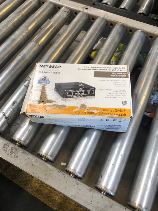 Photo 1 of NETGEAR 5-Port Gigabit Ethernet Unmanaged Essentials Switch (GS305) - Home Network Hub, Office Ethernet Splitter, Plug-and-Play, Silent Operation, Desktop or Wall Mount