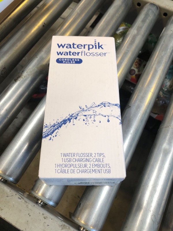 Photo 1 of Waterpik Cordless Pulse Rechargeable Portable Water Flosser for Teeth, Gums, Braces Care and Travel with 2 Flossing Tips, Waterproof, ADA Accepted, WF-20 White, Packaging May Vary