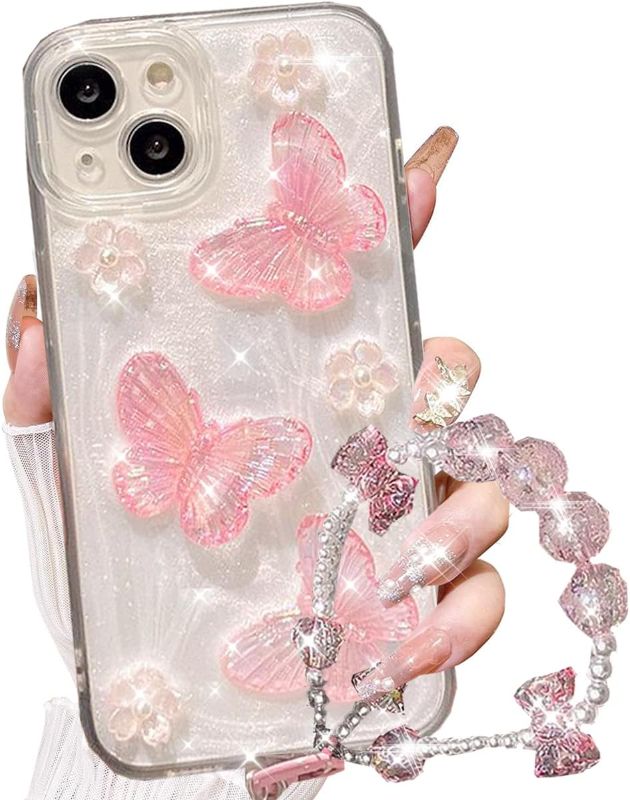 Photo 1 of  iPhone 15 Plus Glitter Butterfly Case,Cute Girly 3D Flower Floral Crystal Pearl Bling Sparkle with Wrist Strap Chain Soft TPU Aesthetic Women Girls Protective Case for iPhone 15 Plus,Pink