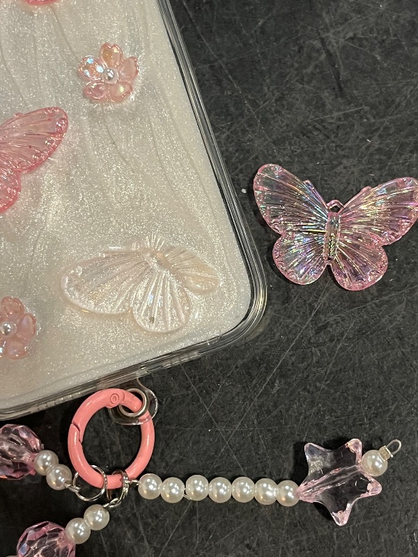 Photo 1 of  iPhone 15 Plus Glitter Butterfly Case,Cute Girly 3D Flower Floral Crystal Pearl Bling Sparkle with Wrist Strap Chain Soft TPU Aesthetic Women Girls Protective Case for iPhone 15 Plus,Pink