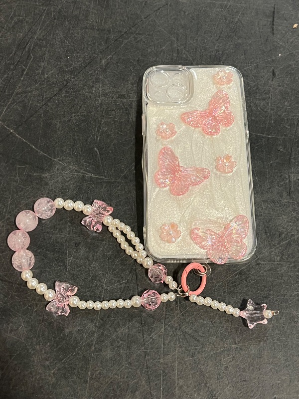 Photo 1 of  iPhone 15 Plus Glitter Butterfly Case,Cute Girly 3D Flower Floral Crystal Pearl Bling Sparkle with Wrist Strap Chain Soft TPU Aesthetic Women Girls Protective Case for iPhone 15 Plus,Pink