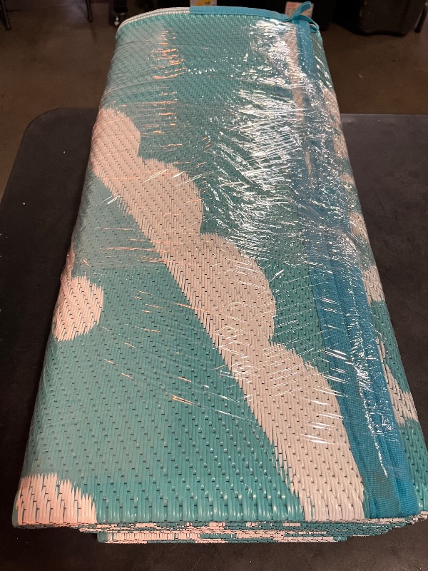 Photo 1 of Bsmathom Waterproof Outdoor Rug 6'x9' Reversible Boho Plastic Straw Patio Deck Camping Rugs, Indoor Outdoor Portable RV Mat Clearance Carpet for Outside, Porch, Balcony, Backyard, Beach, Pool,Teal
