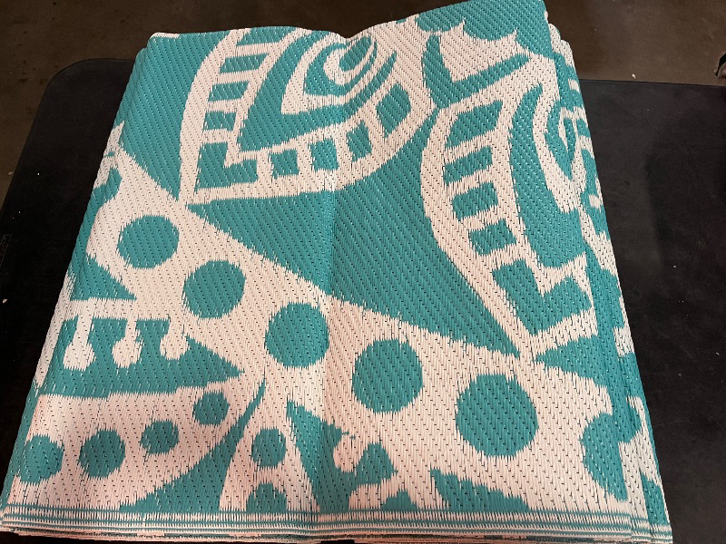 Photo 1 of Bsmathom Waterproof Outdoor Rug 6'x9' Reversible Boho Plastic Straw Patio Deck Camping Rugs, Indoor Outdoor Portable RV Mat Clearance Carpet for Outside, Porch, Balcony, Backyard, Beach, Pool,Teal
