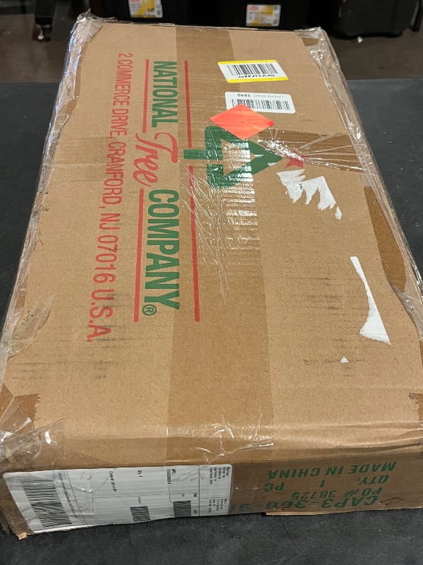 Photo 1 of National Tree Company 9 ft Pre-Lit Carolina Pine Artificial Christmas Garland, Christmas Decoration with Pinecones, 100 Clear Lights, 240 Tips, Green
