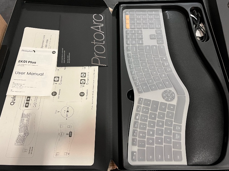Photo 1 of Backlit Bluetooth Ergonomic Keyboard, ProtoArc EK01 Plus Full Size Wireless Split Keyboard with Dual Bluetooth and USB, Cushioned Wrist Rest, Rechargeable for Windows/Mac/Android, Grey Black

