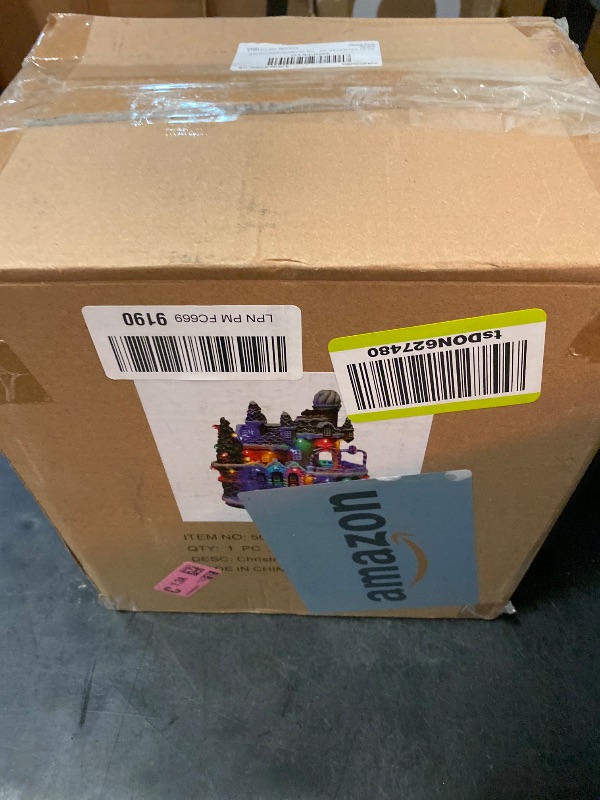 Photo 1 of MUMTOP Christmas Village Gingerbread House with Rotating Car, LED Colorful Lights Animated Candy House Figurine with Music for Indoor Holiday Christian Tabletop Decor