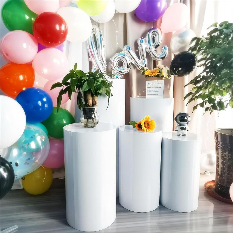 Photo 1 of Cylinder Pedestal Stands for Parties,Metal Cylinder Stands for Party White Round Display Pedestal Stand for Wedding Props Birthday Babyshower Party Event Decor (5PC(90/75/60/55/50))