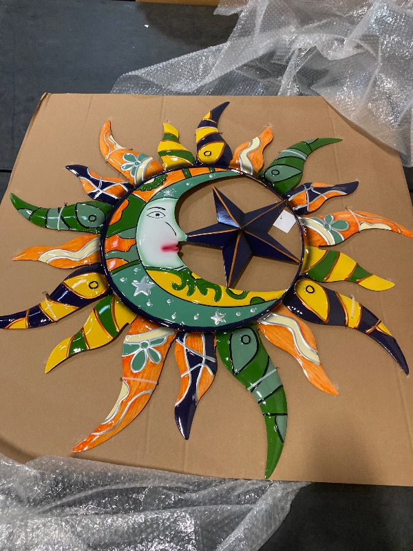 Photo 1 of Metal Sun and Moon Indoor Outdoor Abstract Patterned Wall Decor with Teal and Orange Accents, 36" x 2" x 36", Multi Colored