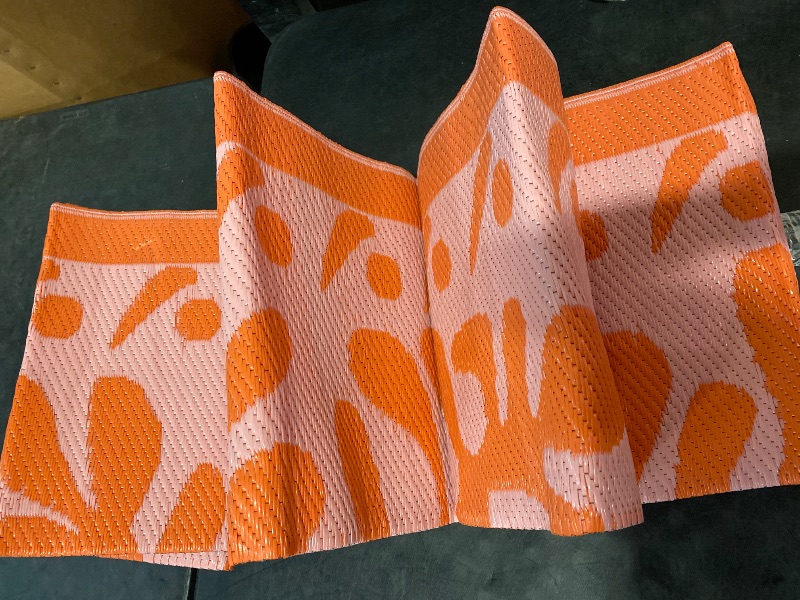 Photo 1 of 8x10 Outdoor Rug for Patios Clearance, Waterproof Camping Rug for Outside RV, Reversible Plastic Straw Outside Rugs, Large Outdoor Area Rug for Garden, Camper, Pool Deck(Orange,8’x10’)